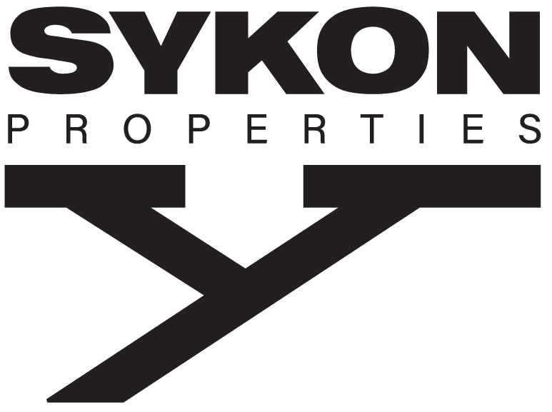 Sykon Properties official logo in white, representing a leading real estate agency in Dubai.